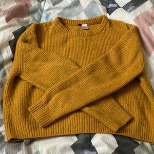 Size small; orangish-yellowish sweater